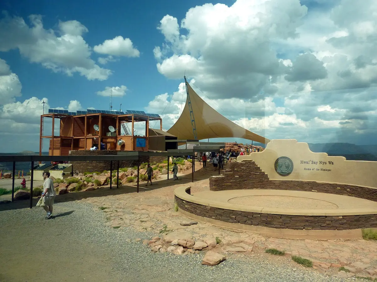 Eagle Point plaza with shade sails and visitors on a sunny day