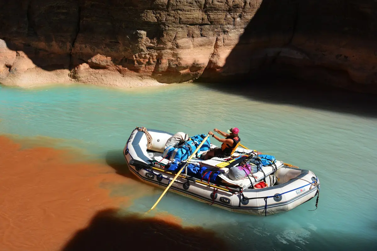 Inflatable raft on turquoise water at the Havasu Creek confluence
