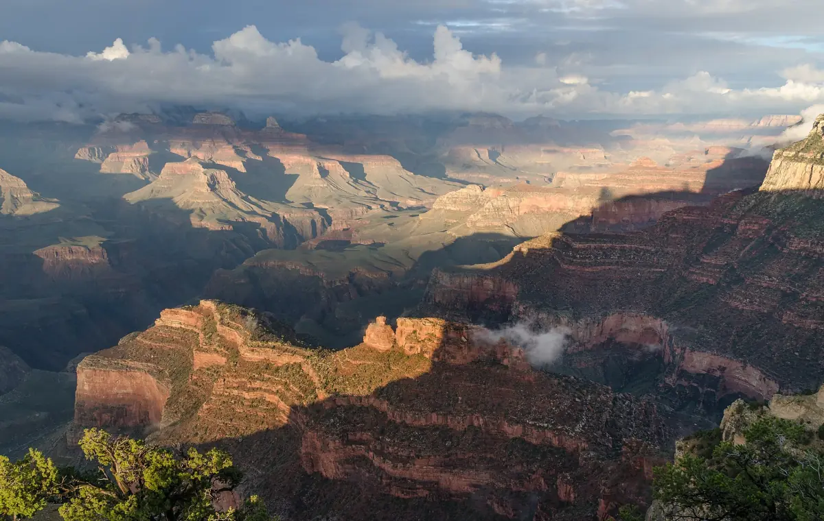 South Rim buttes in soft evening light with clouds above